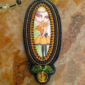 Hand beaded cabachon with beaded chain